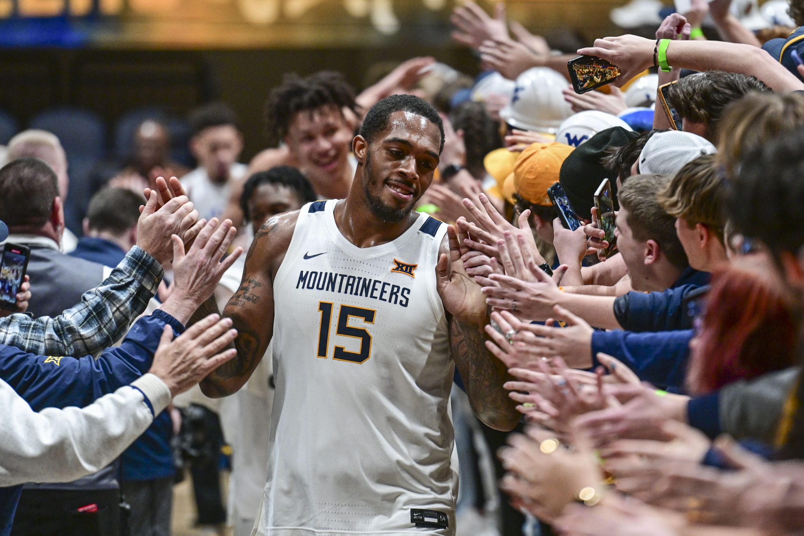 Basketball center Jimmy Bell Jr. on a 'trial run' with WVU football